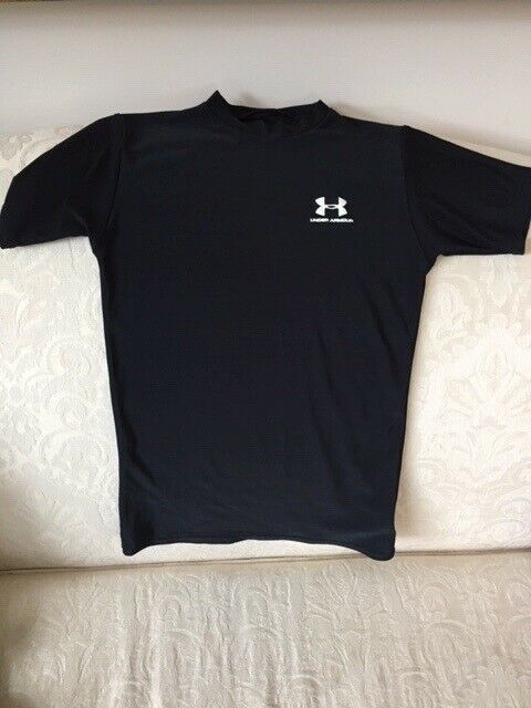 Gently used Under Armour youth large black shirt sleeved polyester
